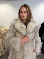 Side profile of white Nordic fox fur coat, full length