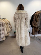 Full-length white Nordic fox fur coat, front view with hands together