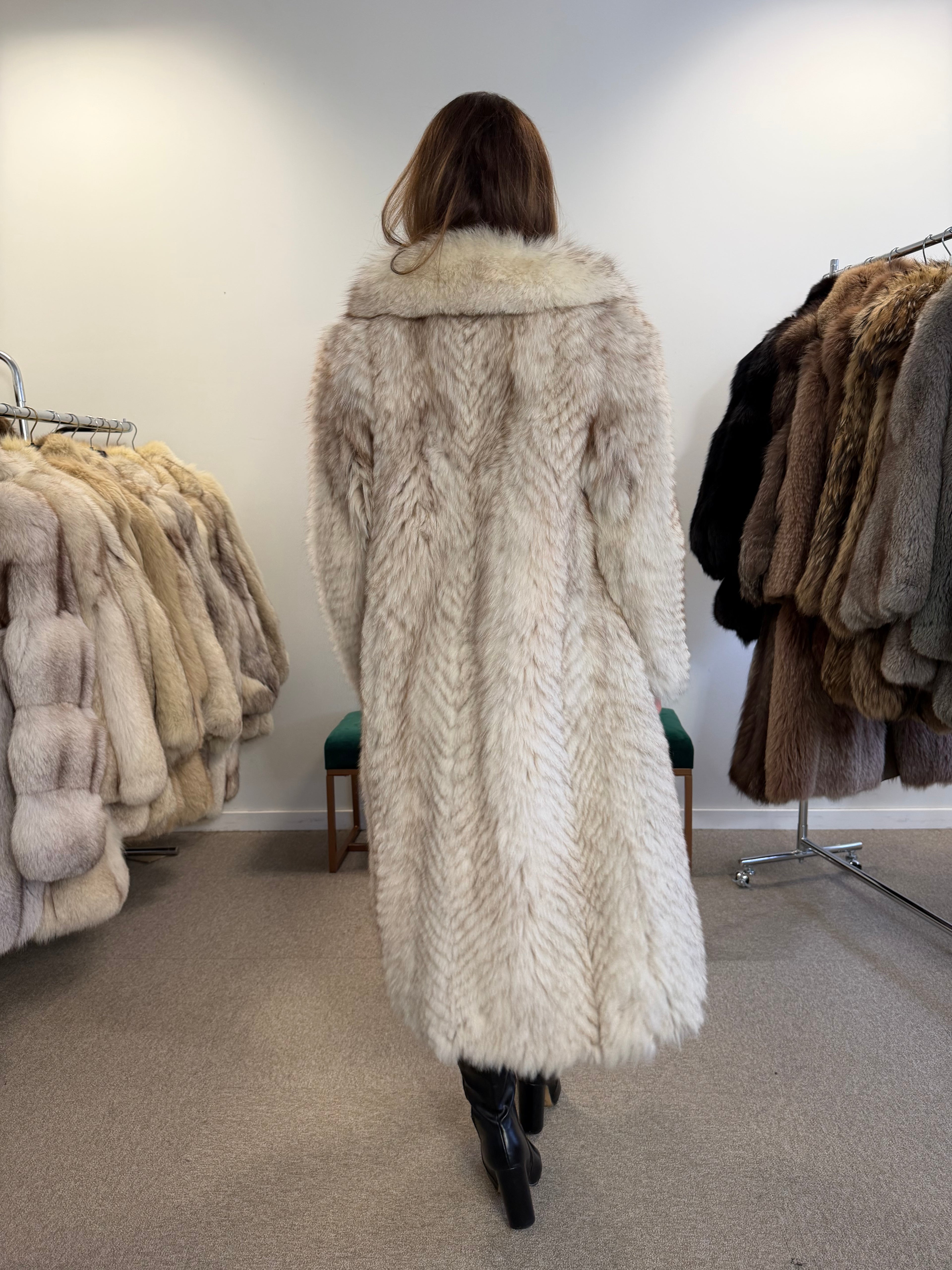 Full-length white Nordic fox fur coat, front view with hands together
