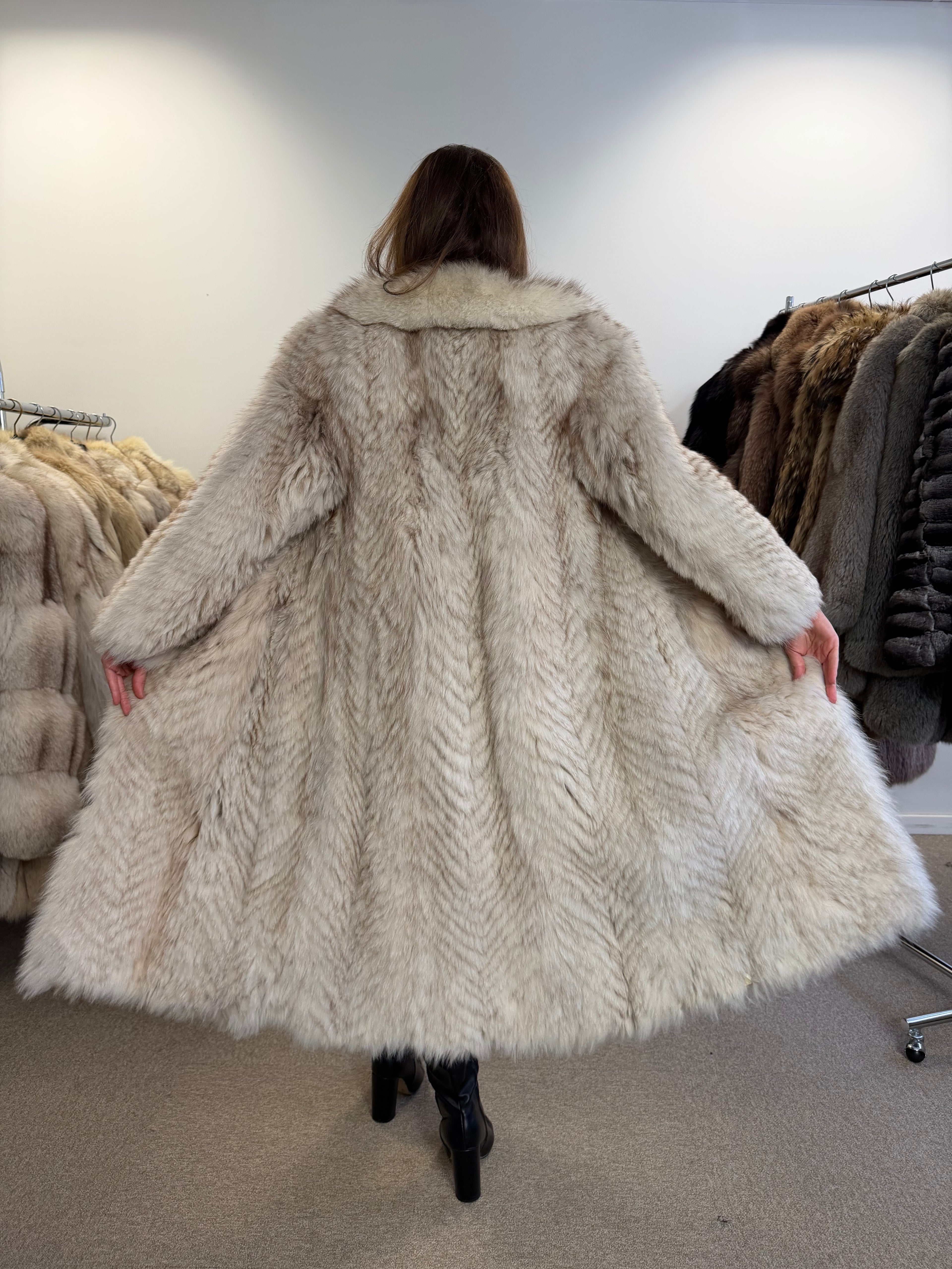Back view of white Nordic fox fur coat, fabric spread wide