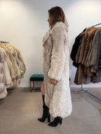 Close-up of white Nordic fox fur coat collar and sleeve