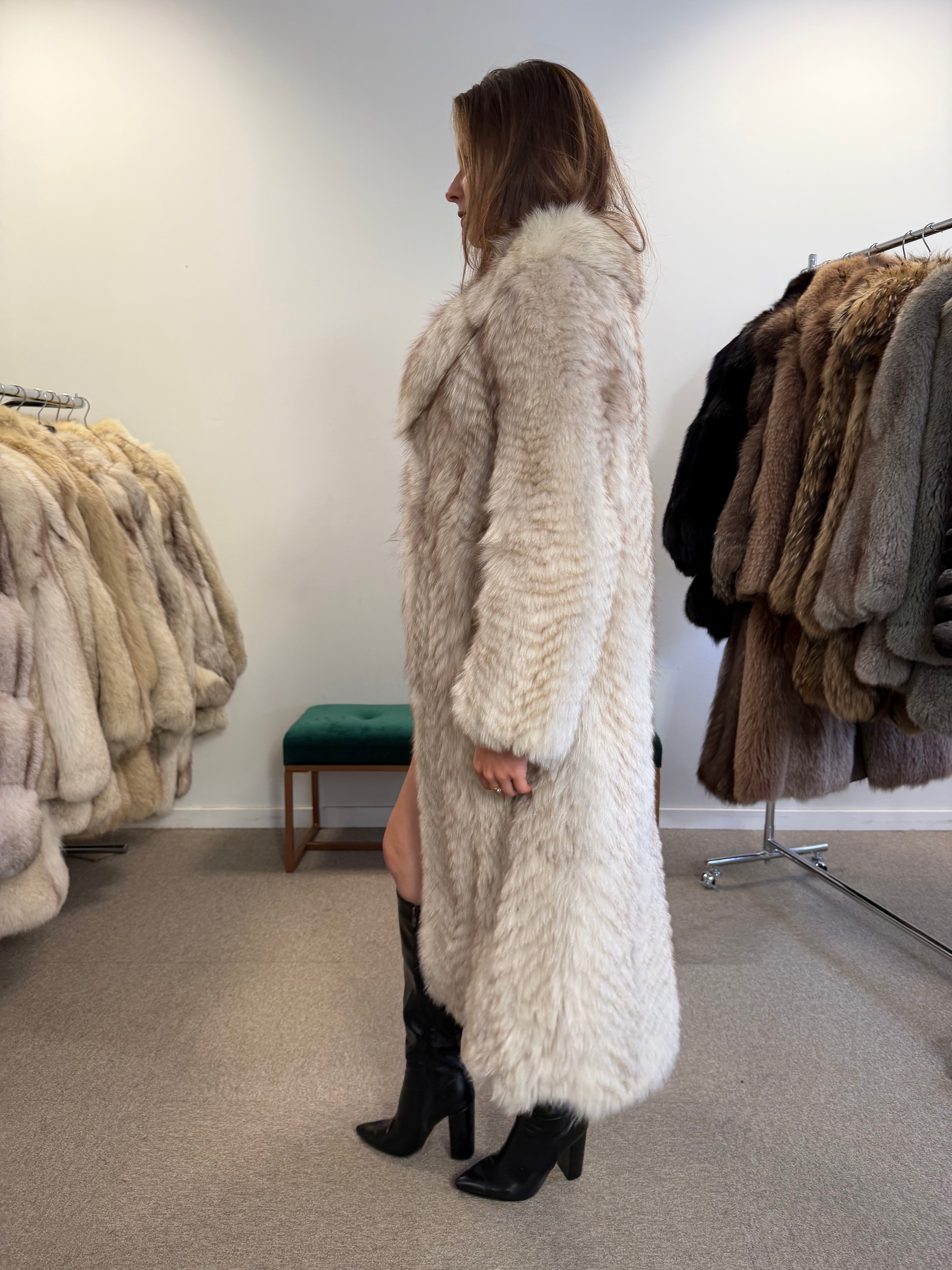Close-up of white Nordic fox fur coat collar and sleeve