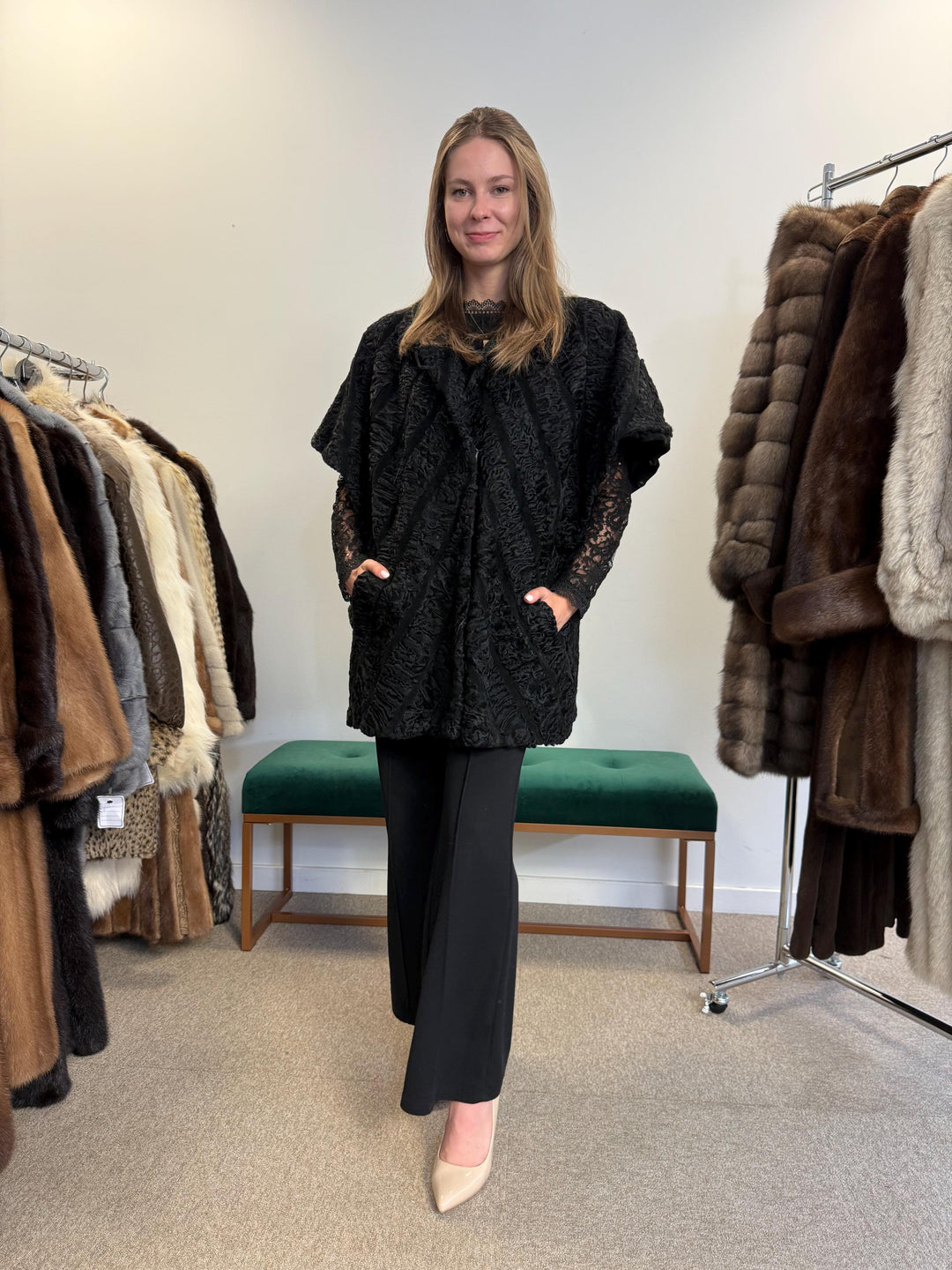 Real black astrakhan fur vest, women’s, vintage rare find, high-quality fur, back view.