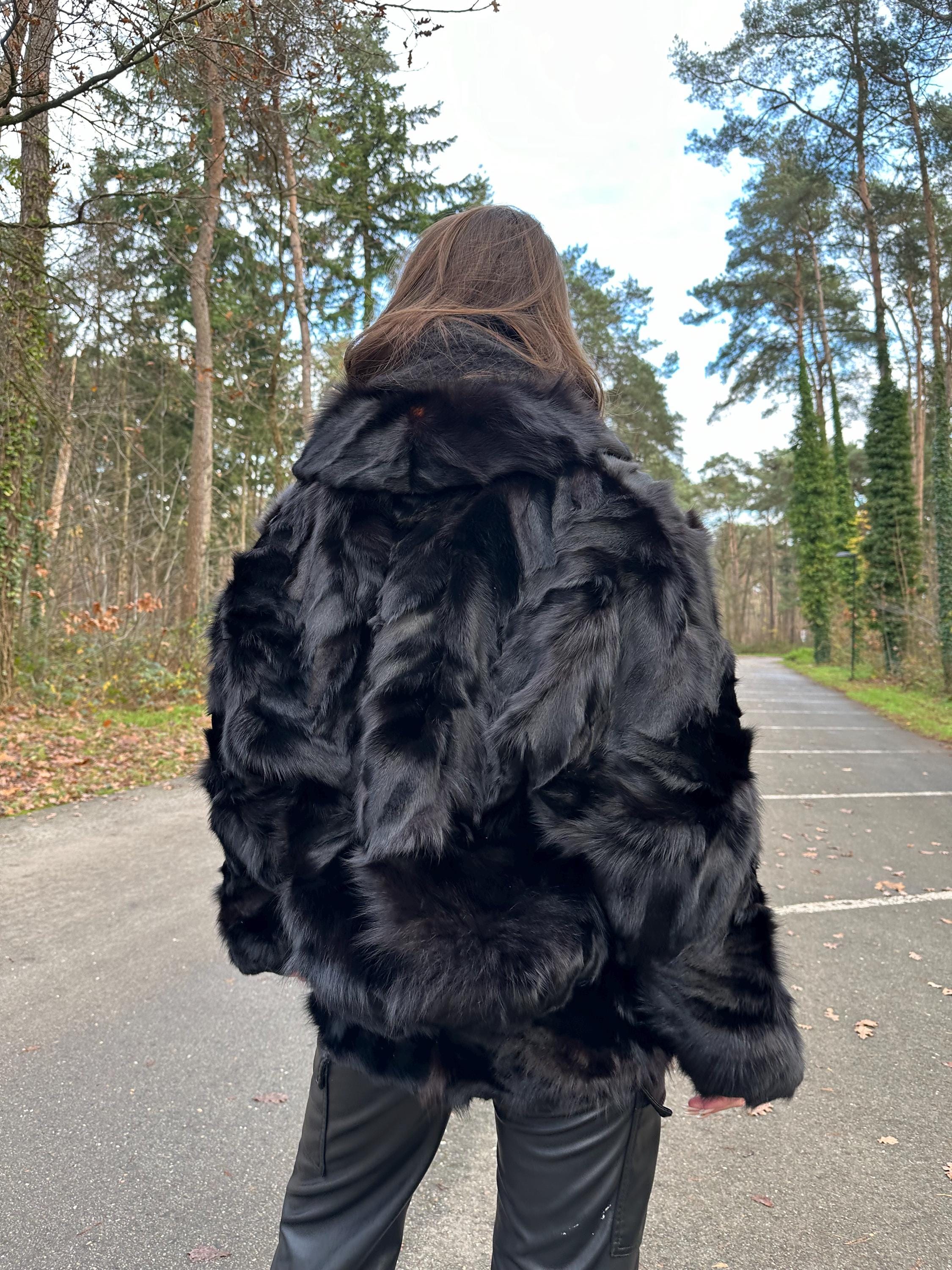 Women’s large black fox fur jacket worn closed, one hook closure, soft luxurious vintage fur.