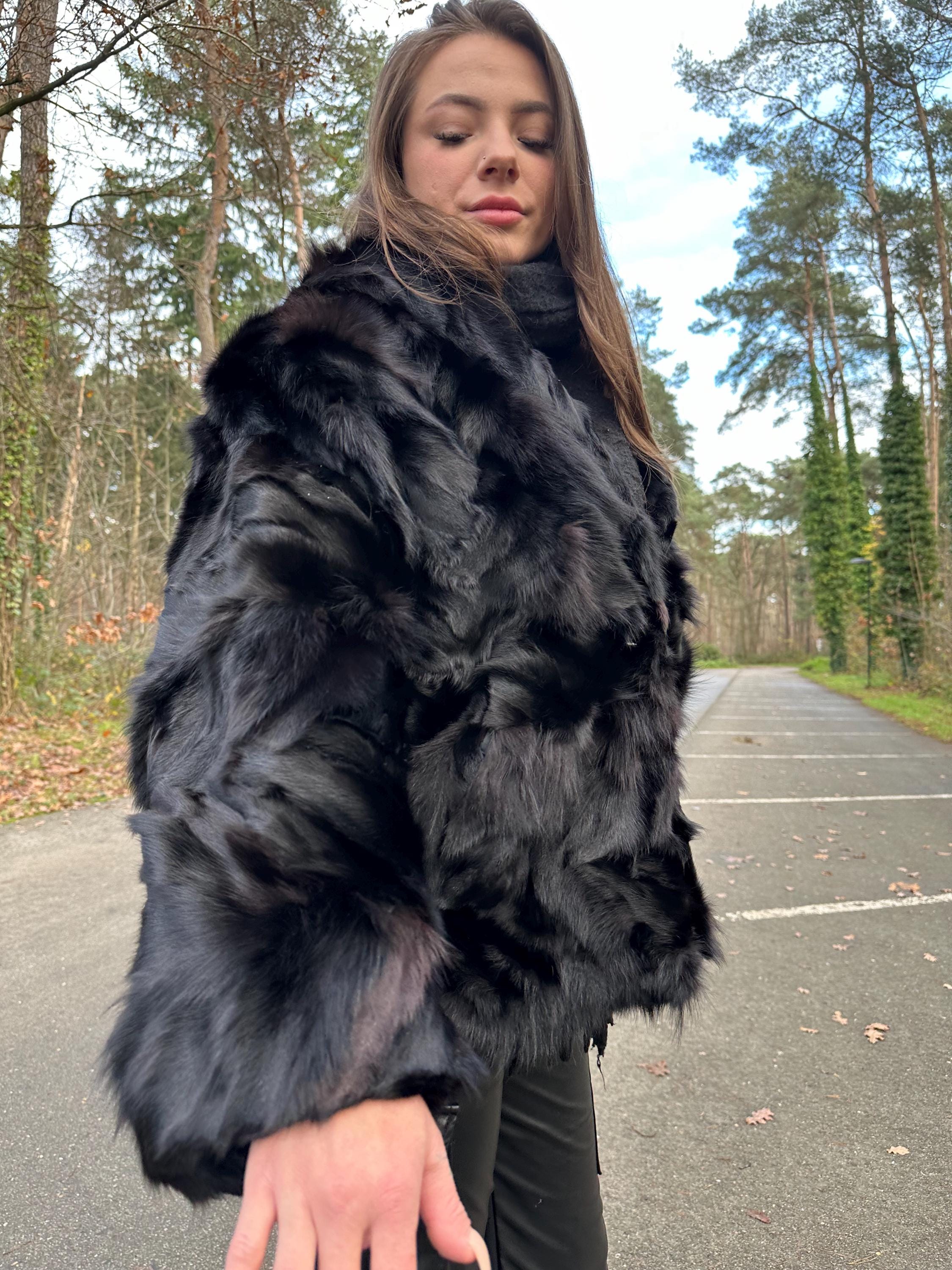 Shoulder and sleeve detail of black fox fur jacket, women’s large size, real vintage fur.