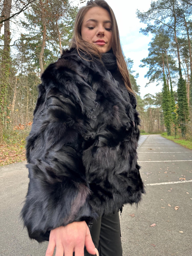 Shoulder and sleeve detail of black fox fur jacket, women’s large size, real vintage fur.