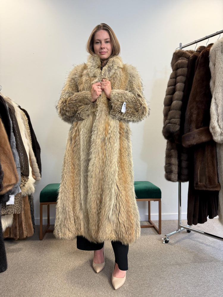 Women’s medium coyote fur coat worn closed, soft thick vintage fur,