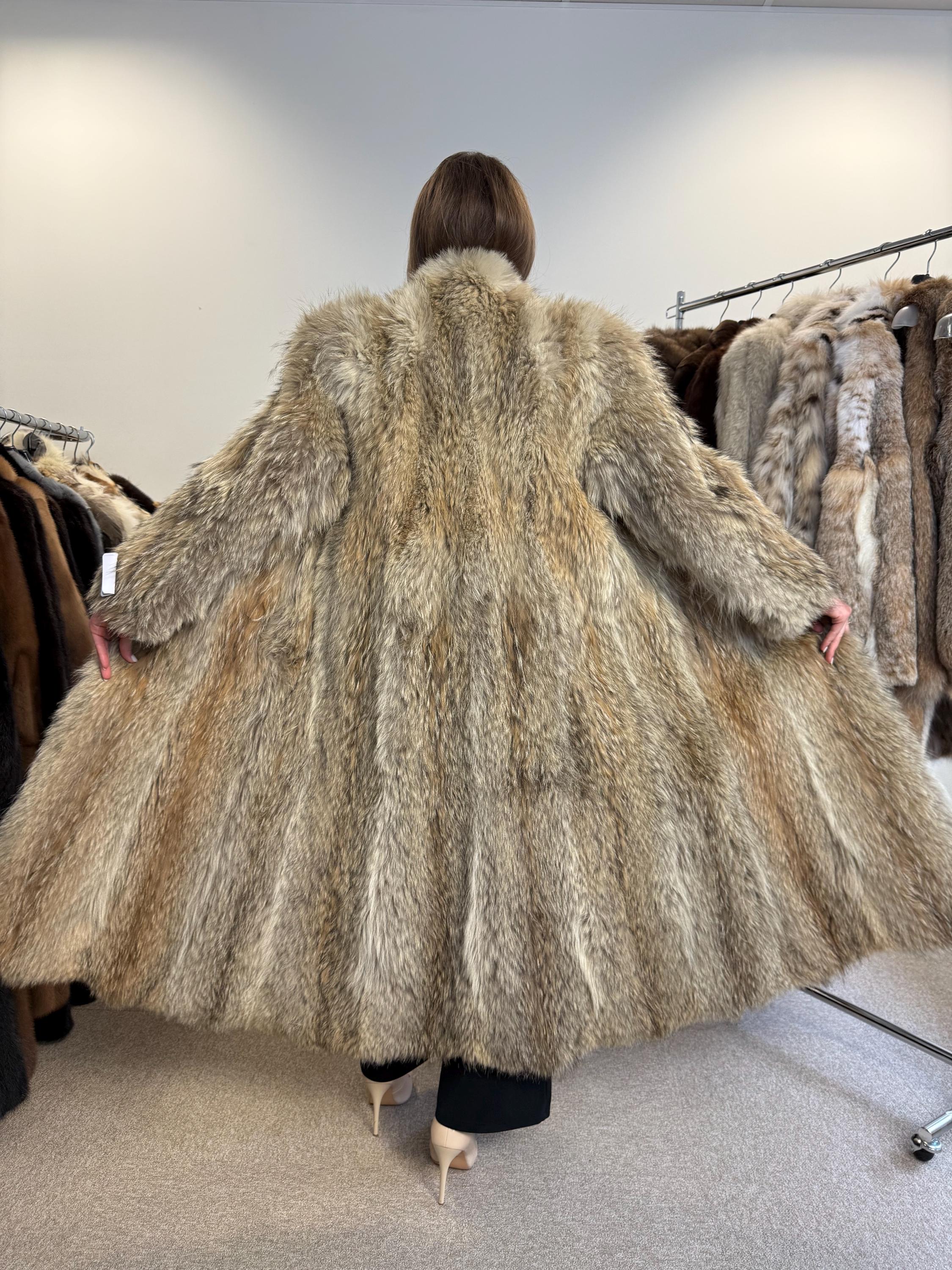 Full body view of medium women’s coyote fur coat, soft thick real fur, full-length vintage jacket.