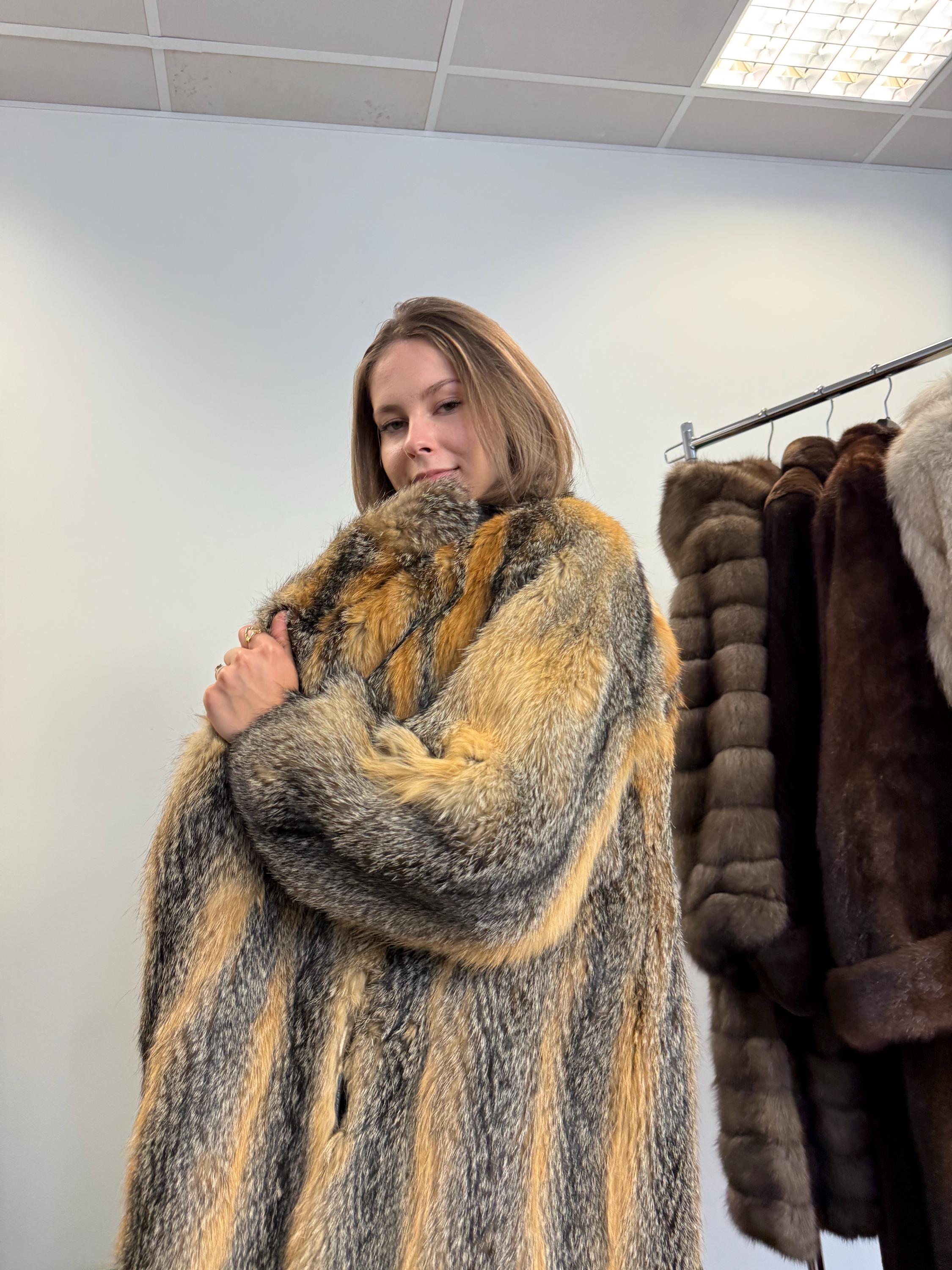 Shoulder and sleeve detail of grey fox fur coat, women’s large, soft fluffy real fur.