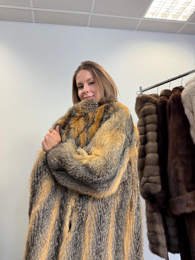 Shoulder and sleeve detail of grey fox fur coat, women’s large, soft fluffy real fur.