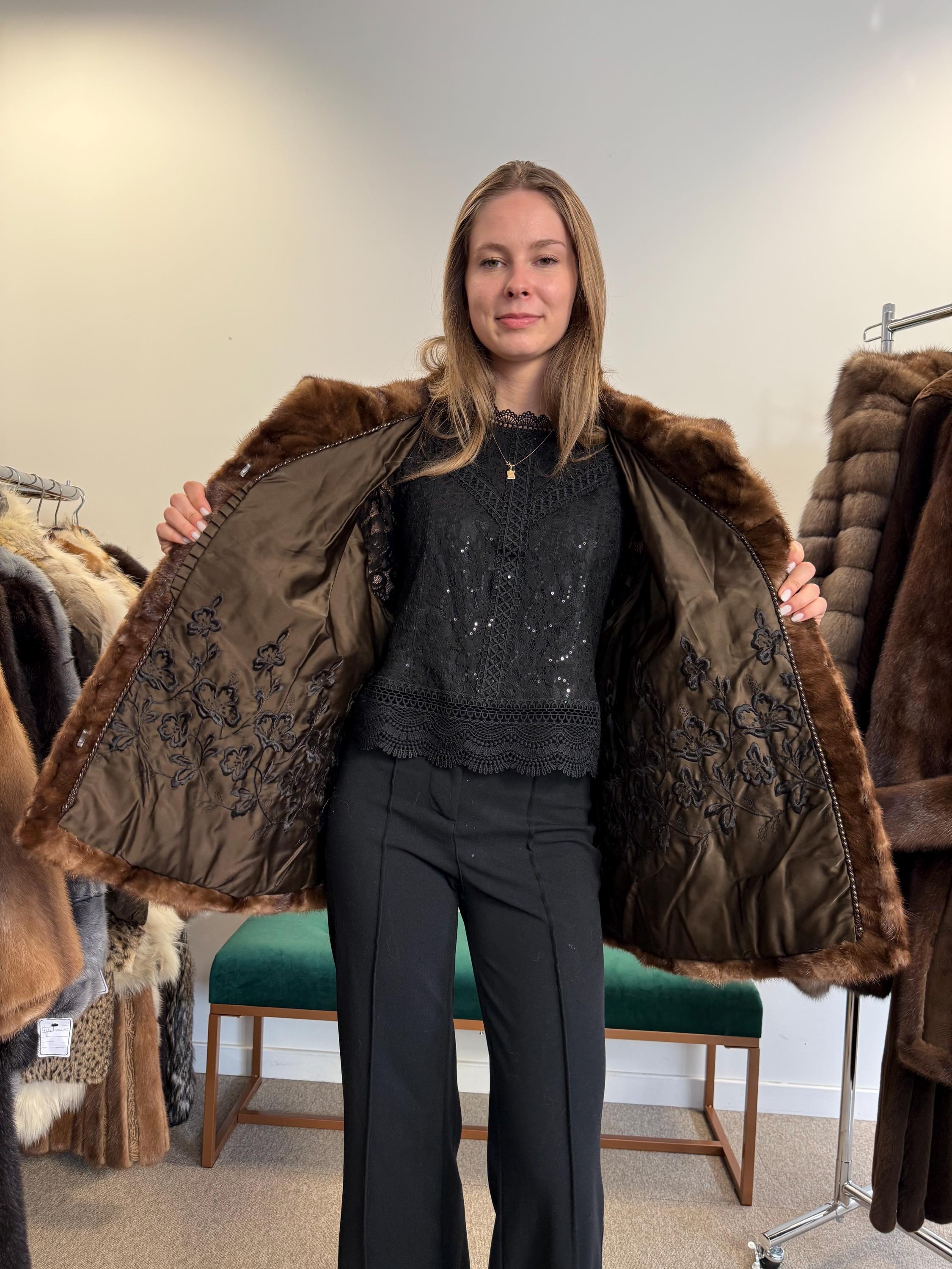 Women’s XL pastel brown mink jacket worn closed, soft luxurious vintage fur.