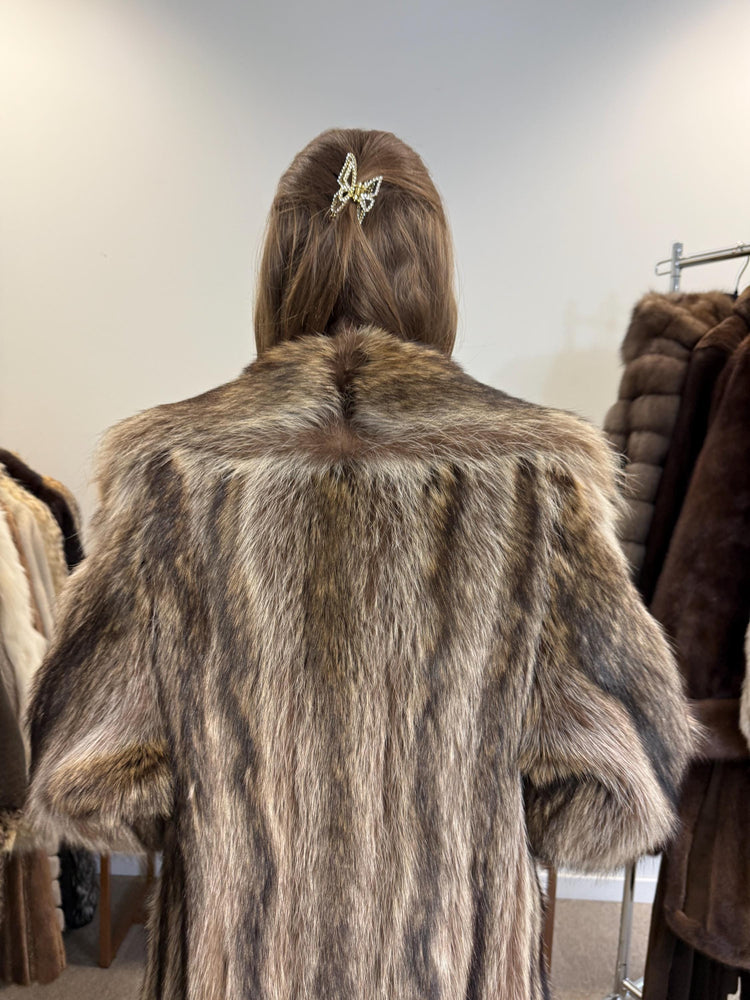 Shoulder and sleeve detail of raccoon fur coat, large women’s size, soft thick vintage fur.