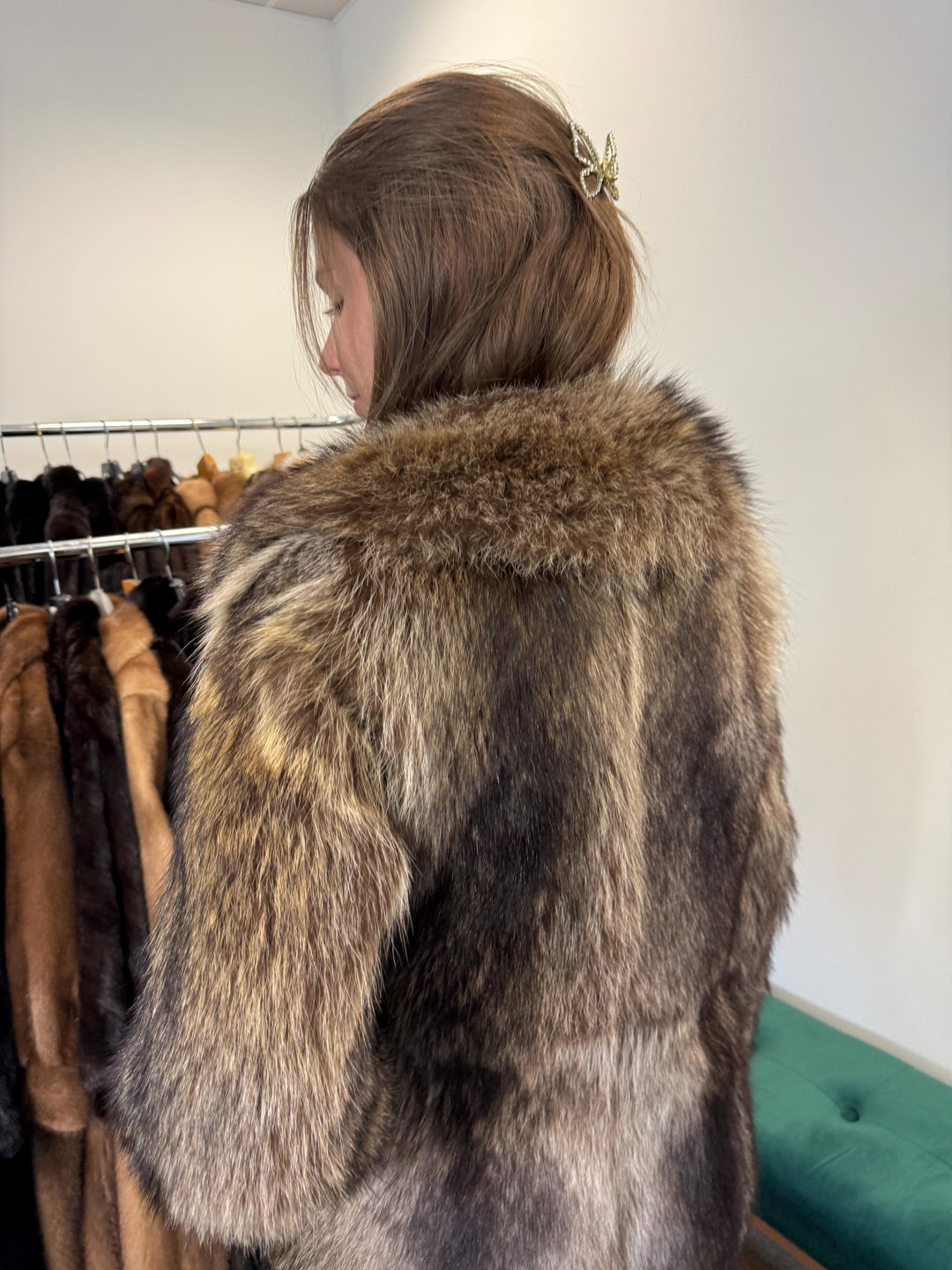 Shoulder and sleeve detail of raccoon fur jacket, women’s soft real fur.