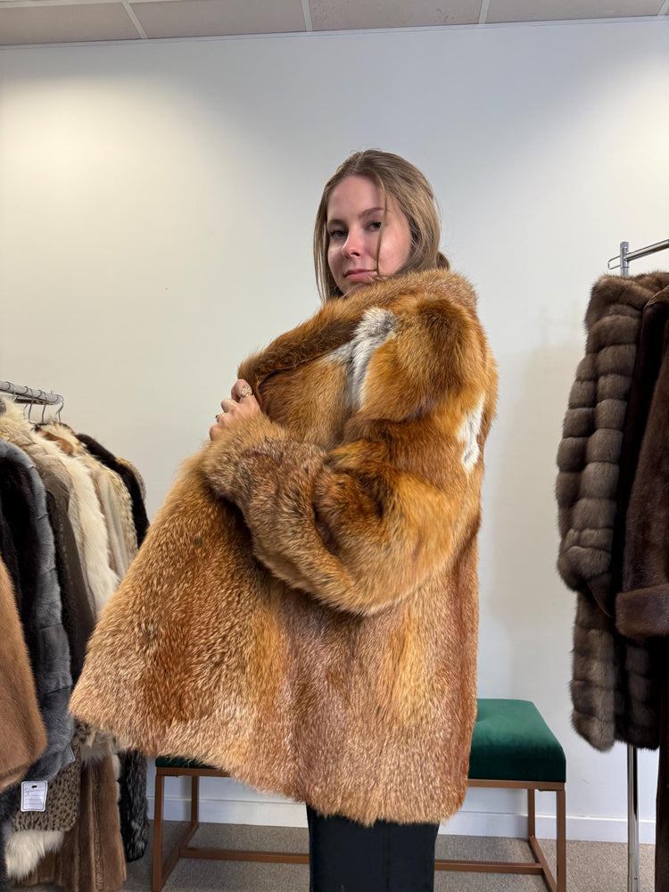 Side view of red fox fur jacket, soft real fur, women’s vintage outerwear.