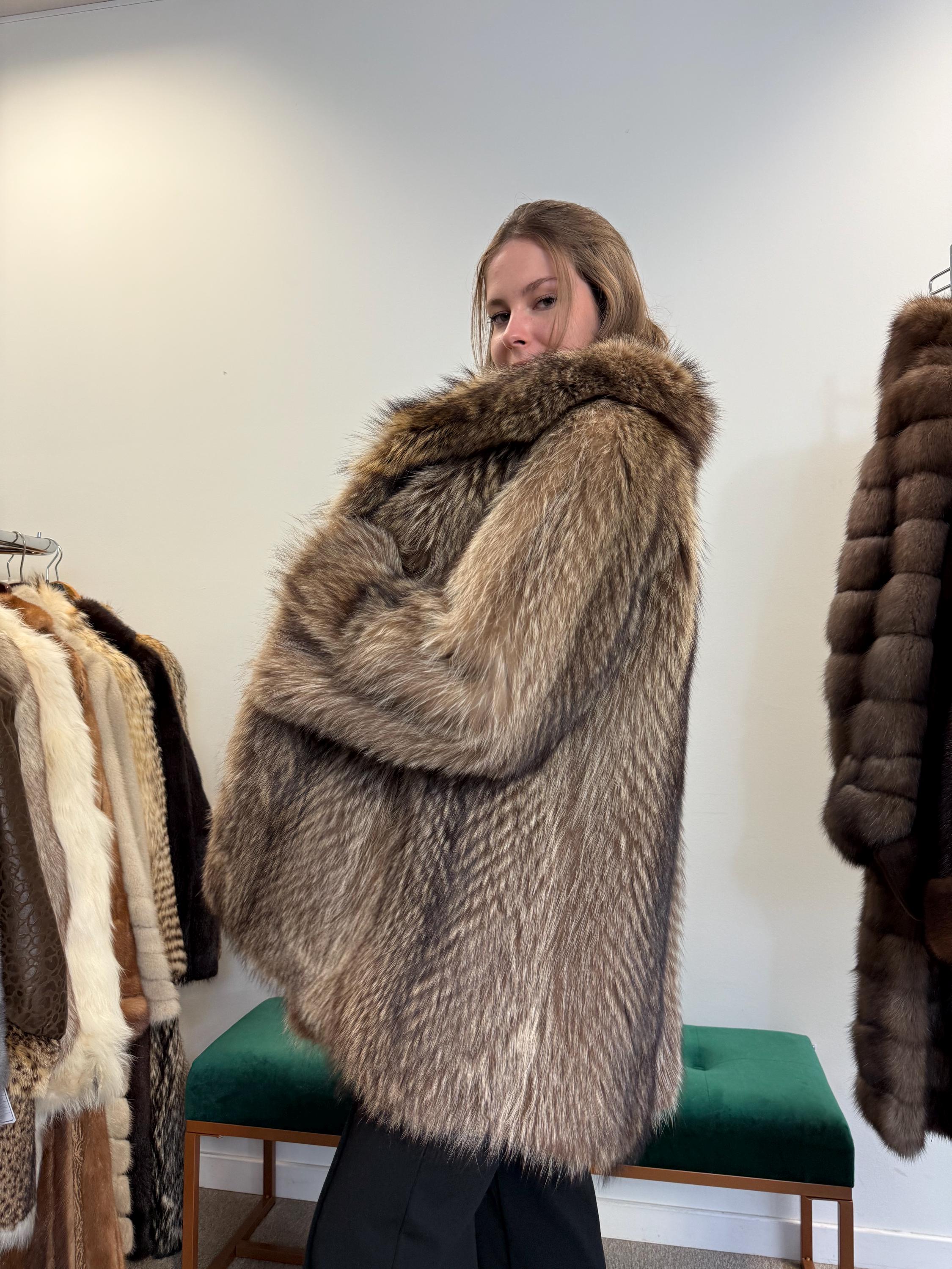 shoulder and sleeve detail of soft raccoon fur coat, women’s L, thick vintage fur.